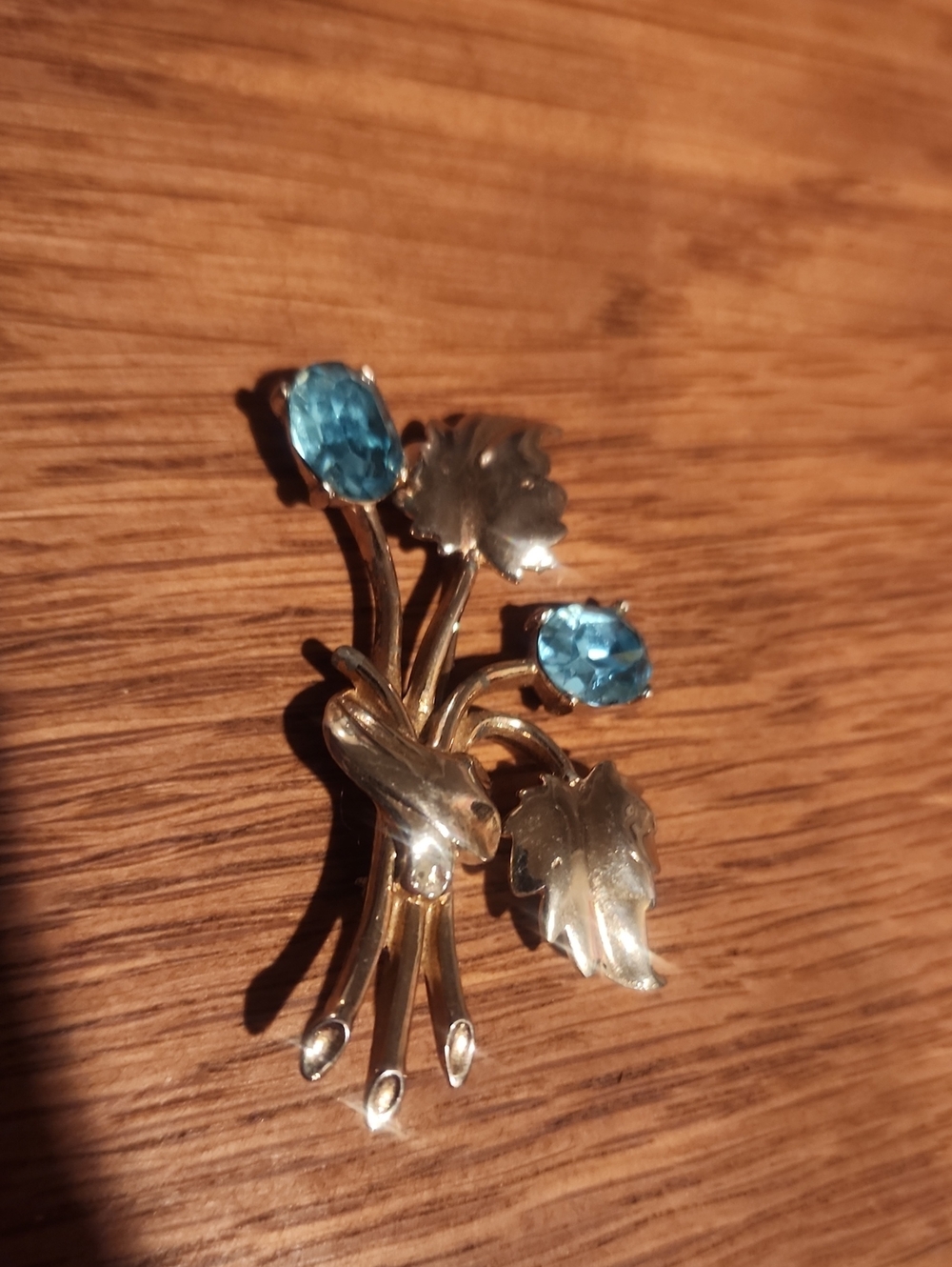 Vintage Silver Toned Floral Brooch with Blue Gem Accents